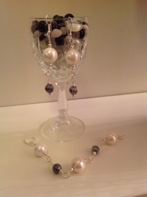 Pearl bracelet and earring set Reconstituted pearl bracelet and earring set. Can be made to order with gold findings and different size pearls. Price is dependant on choice of pearls and chain.