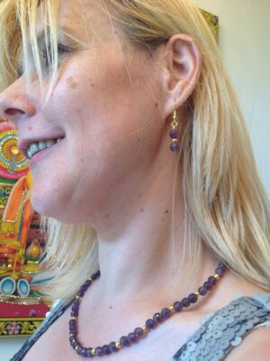 The Aurica - chandelier earrings in rose gold My friend Celma wearing small chandelier earrings in rose gold.