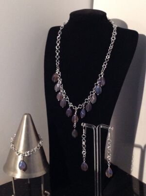 The Taj set The Taj set: Chainmaille and coated mystic Quartz necklace with matching earrings and bracelet.