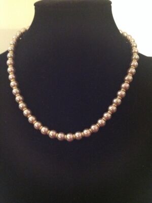 Lakme series necklace In the Lakme series this is a necklace made with lavender colour shell pearls with gold jump ring accents.